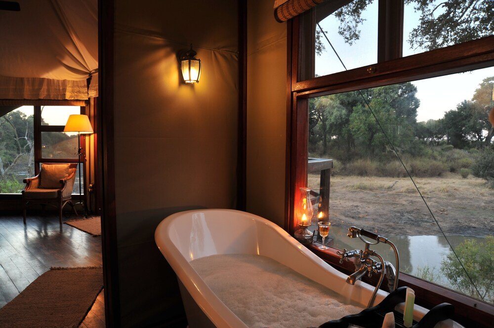 Bathroom with separate bathtub in a Hamiltons Tented Camp tent